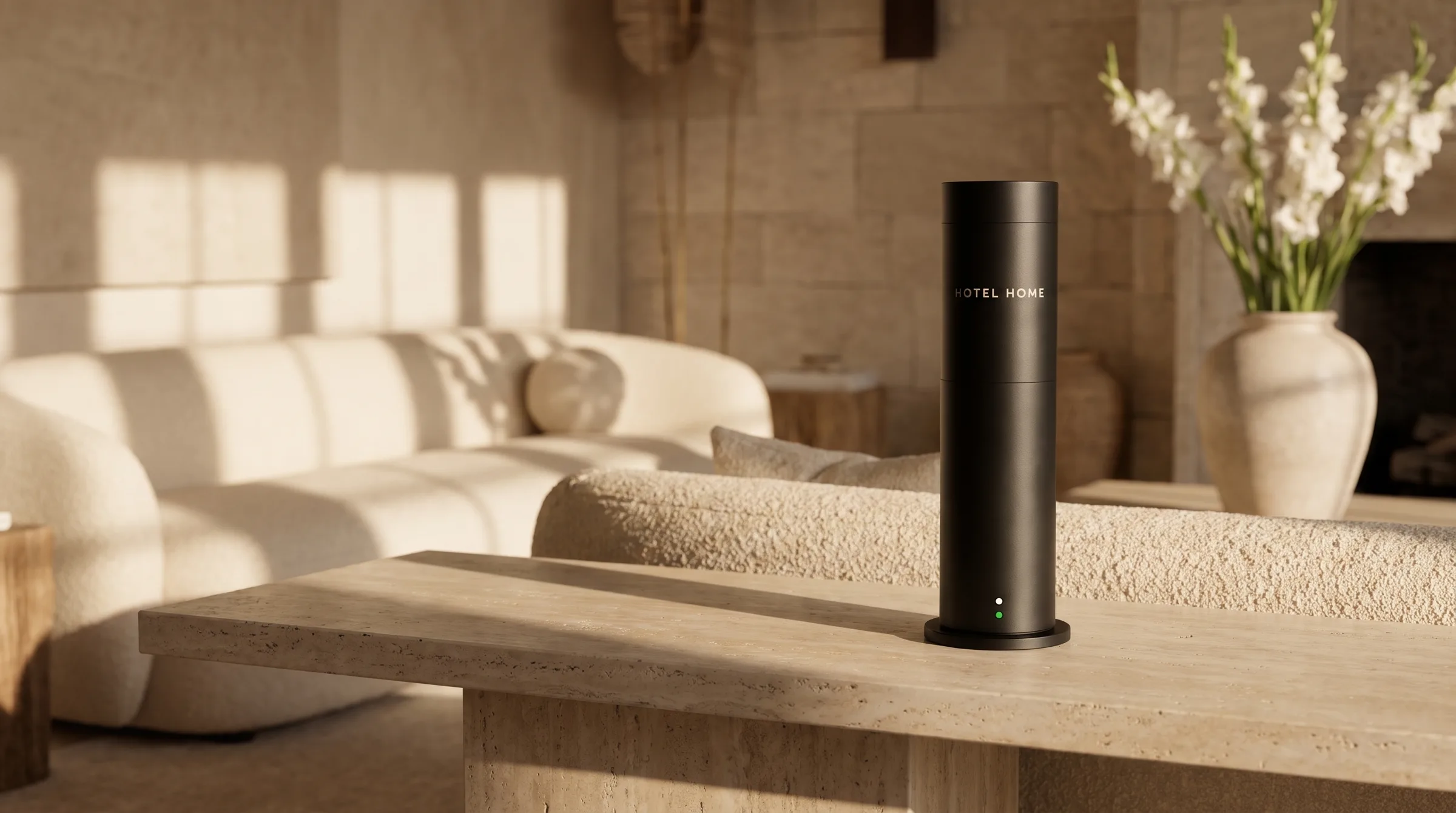The HOTEL HOME diffuser on a travertine table